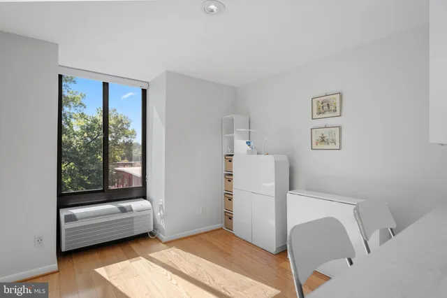 a view of room with workspace and a window