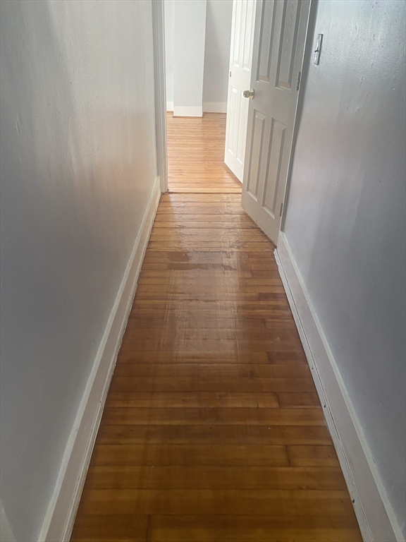 24 Gordon Avenue, Unit 24 Boston, MA 02136 - Photo 12 of 13 a view of a hallway with wooden floor