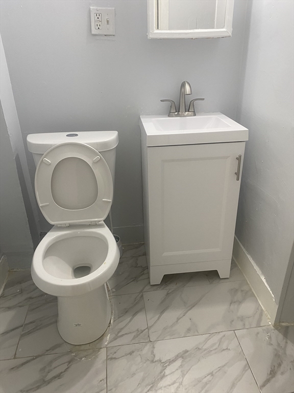 24 Gordon Avenue, Unit 24 Boston, MA 02136 - Photo 7 of 13 a bathroom with a toilet and a sink