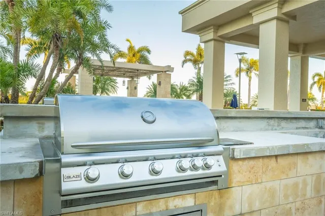 a view of roof deck with couches and potted plants