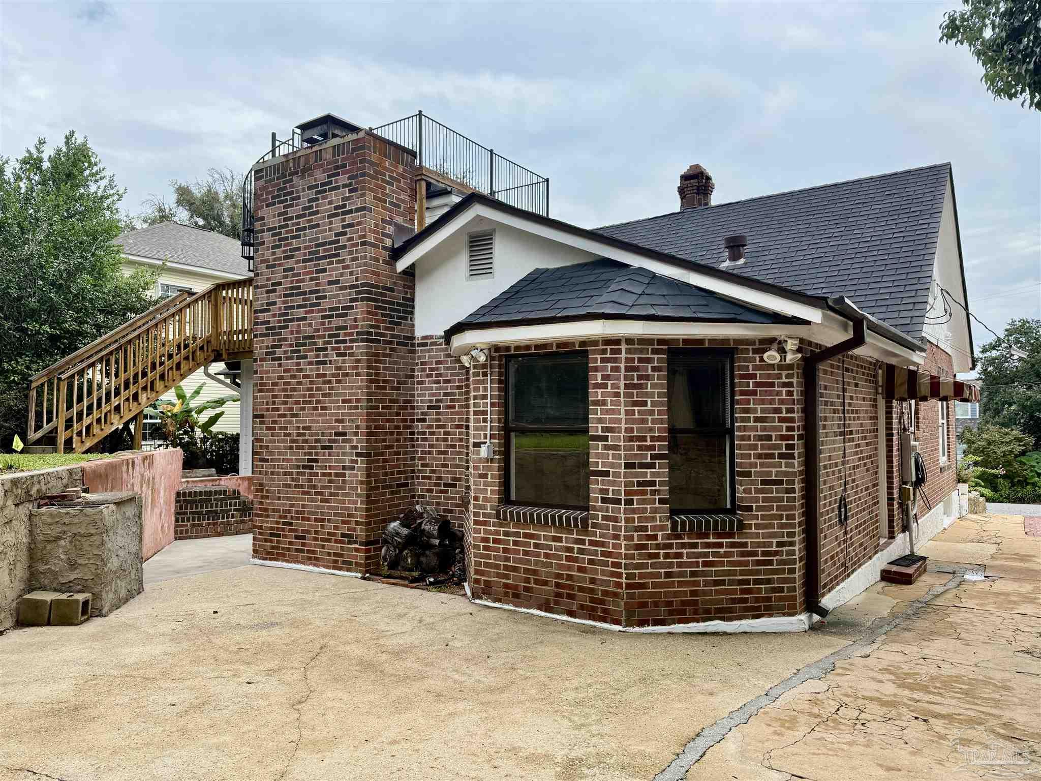 1717 Yates Avenue Pensacola, FL 32503 - Photo 12 of 47 a front view of a house with garage