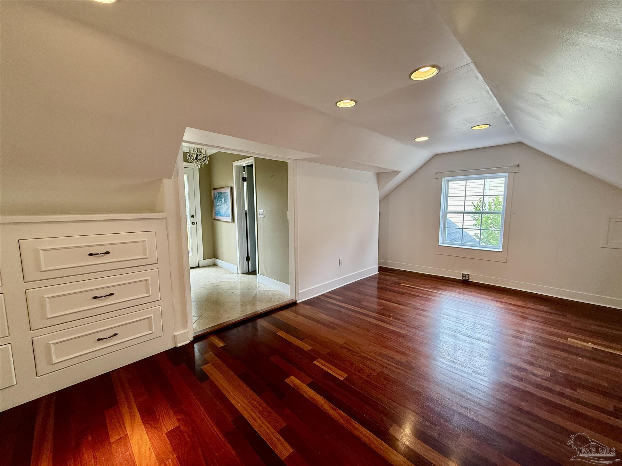 1717 Yates Avenue Pensacola, FL 32503 - Photo 16 of 47 a view of an empty room with window and wooden floor
