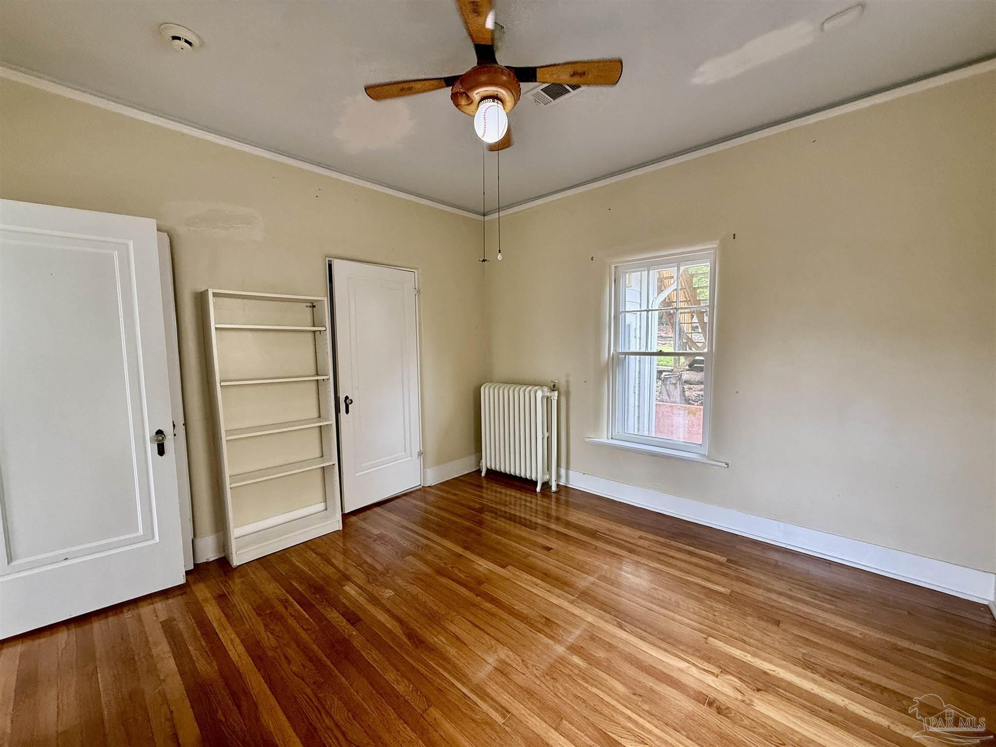1717 Yates Avenue Pensacola, FL 32503 - Photo 19 of 47 wooden floor in an empty room with a window