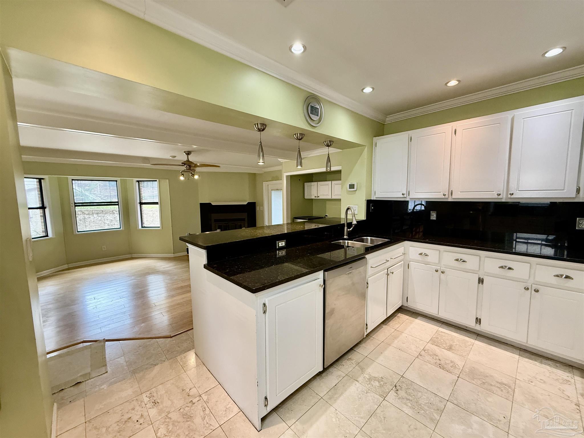 1717 Yates Avenue Pensacola, FL 32503 - Photo 35 of 47 a large white kitchen with granite countertop a stove and a sink