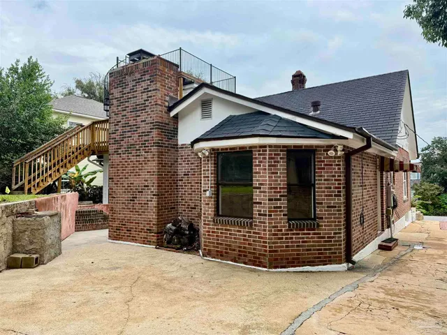 a front view of a house with garage
