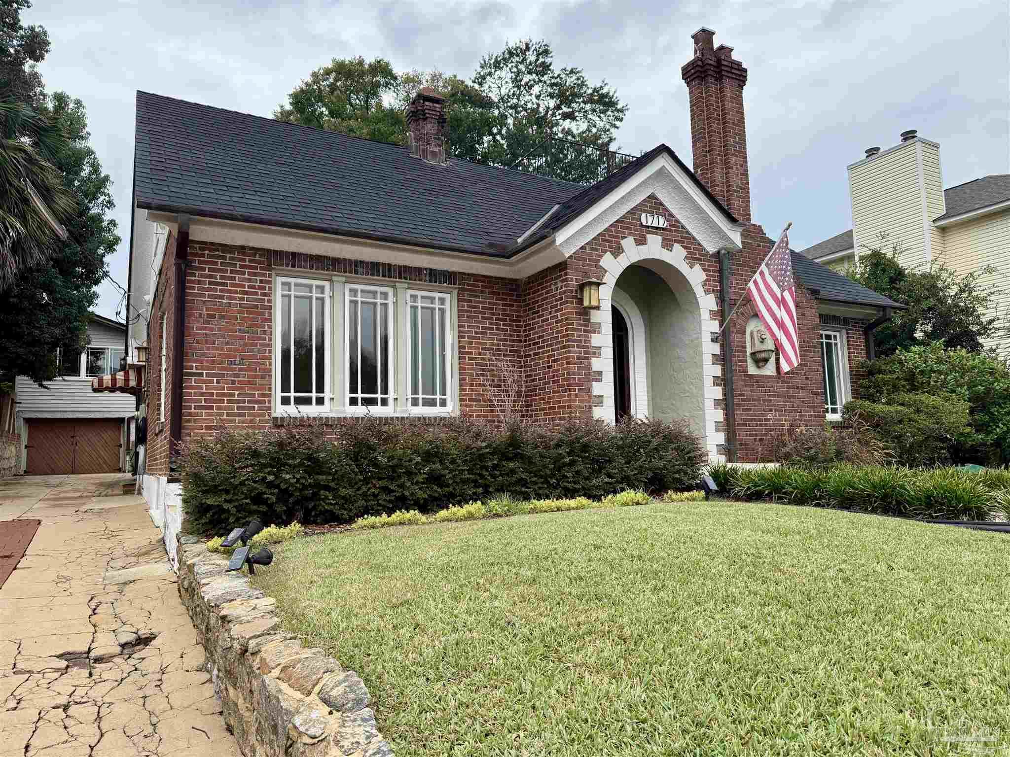 1717 Yates Avenue Pensacola, FL 32503 - Photo 10 of 47 a front view of a house with garden