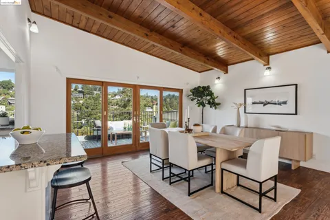 a view of a livingroom with furniture window and wooden floor