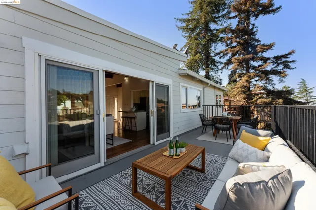 a kitchen with cabinets stainless steel appliances and wooden floor