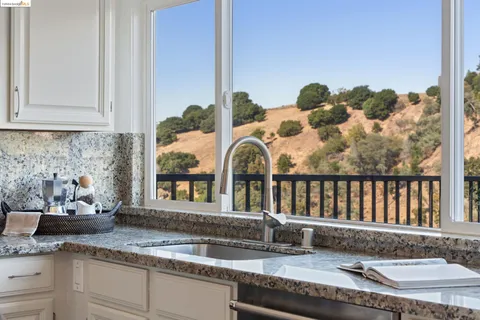 a bathroom with a double vanity sink a mirror and a shower