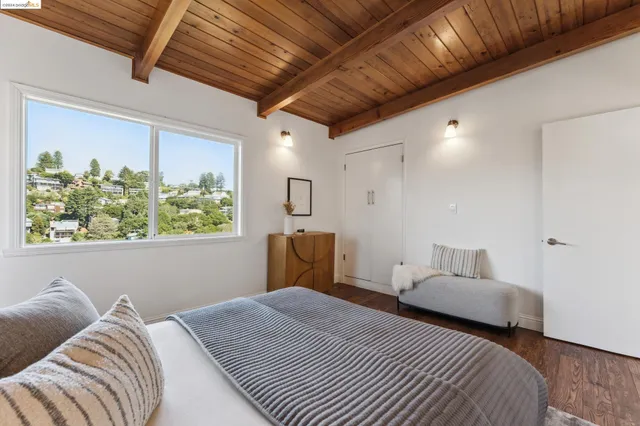 a bedroom with a bed and a couch