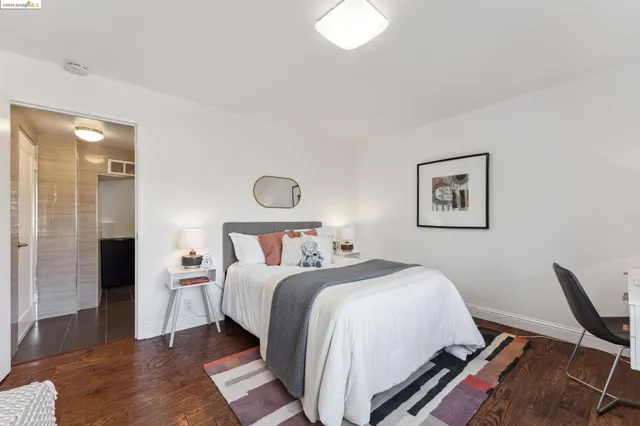 a bathroom with a sink a potted plant and shower