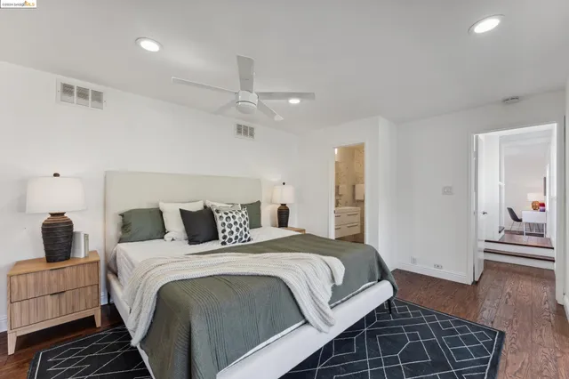 a balcony with wooden floor and outdoor seating