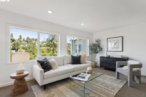 a view of a town with mountains in the background