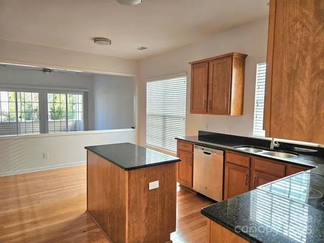 a kitchen with granite countertop a sink and a granite counter tops