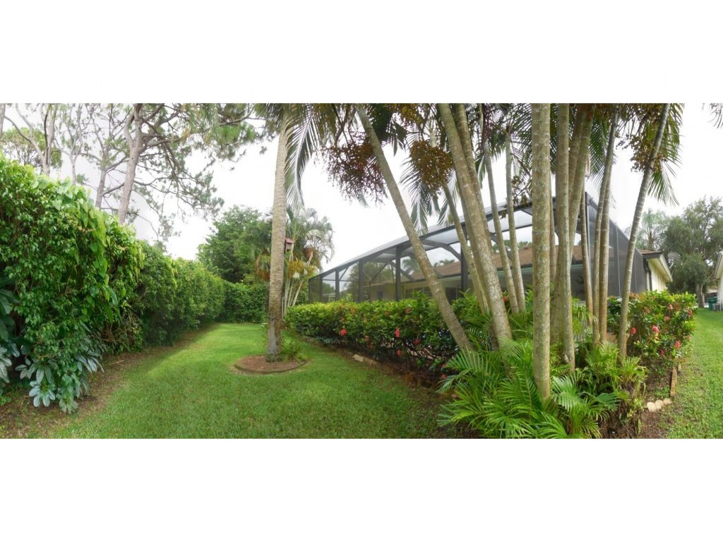 4517 Parrot Avenue Naples, FL 34104 - Photo 12 of 13 a balcony with lots of green space