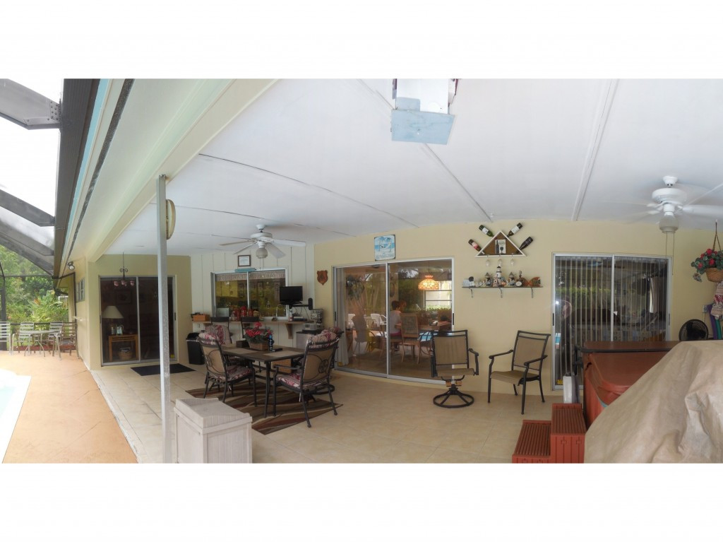 4517 Parrot Avenue Naples, FL 34104 - Photo 4 of 13 a living room with furniture