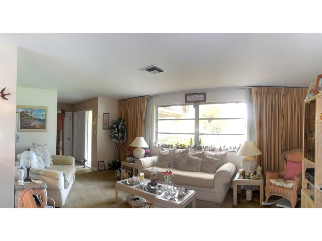 4517 Parrot Avenue Naples, FL 34104 - Photo 5 of 13 a living room with furniture and a window