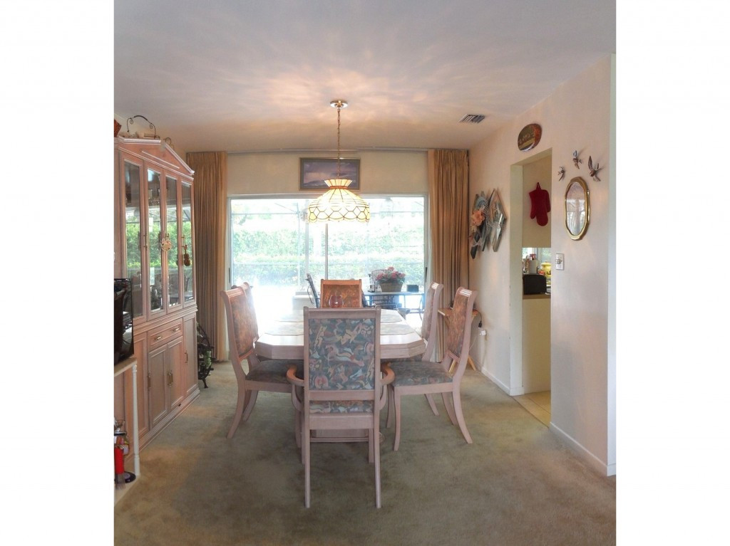 4517 Parrot Avenue Naples, FL 34104 - Photo 6 of 13 a dining room with furniture and window