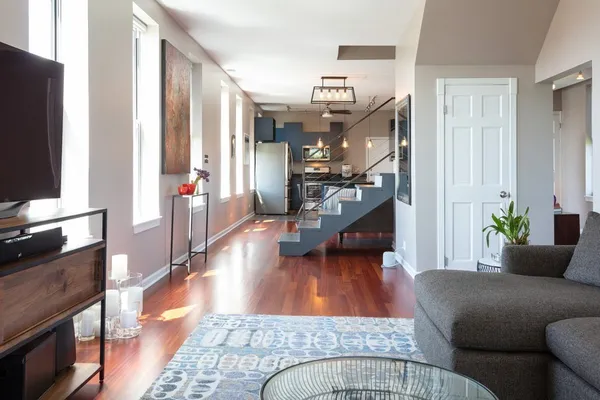 a living room with furniture and a flat screen tv