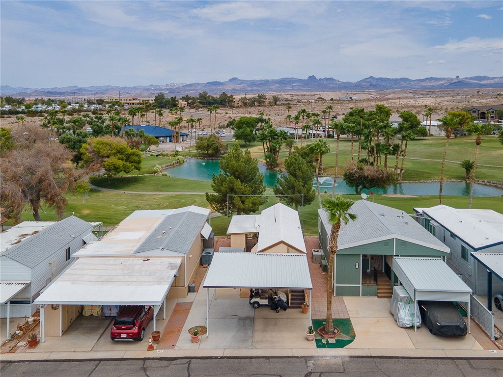 2000 Ramar Road, Unit 612 Bullhead City, AZ 86442 - Photo 38 of 77 Aerial view of residential area featuring a water and mountain view and a local golf course