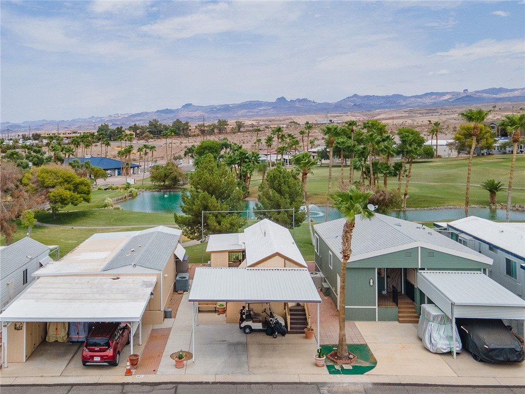 2000 Ramar Road, Unit 612 Bullhead City, AZ 86442 - Photo 39 of 77 Aerial view of residential area featuring a water and mountain view and a golf course