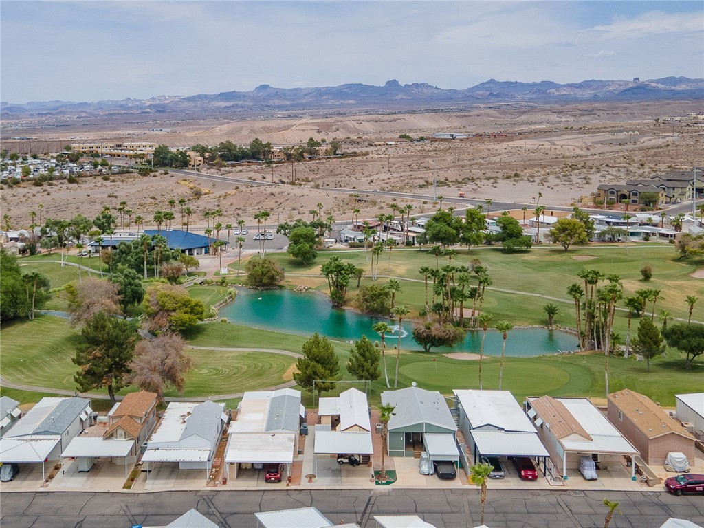 2000 Ramar Road, Unit 612 Bullhead City, AZ 86442 - Photo 42 of 77 Aerial perspective of suburban area featuring a water and mountain view and a golf club