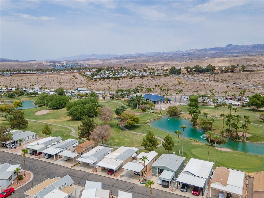2000 Ramar Road, Unit 612 Bullhead City, AZ 86442 - Photo 45 of 77 Aerial perspective of suburban area featuring a water and mountain view and a golf club