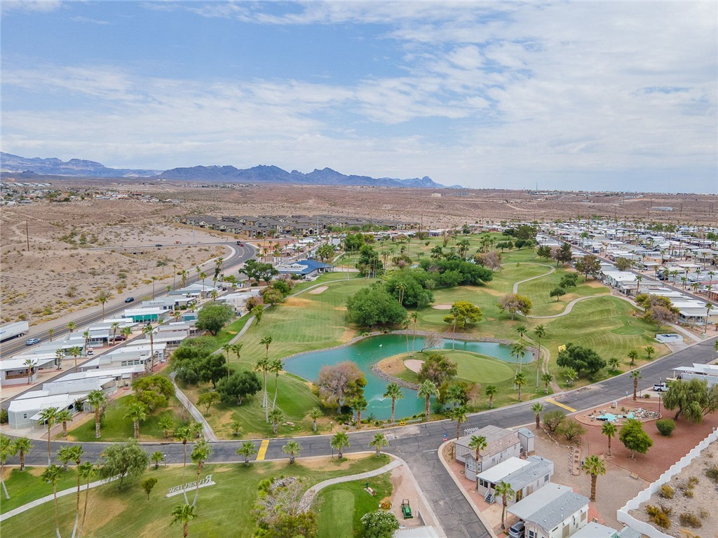 2000 Ramar Road, Unit 612 Bullhead City, AZ 86442 - Photo 51 of 77 View of property location featuring a water and mountain view, a golf course, and nearby suburban area