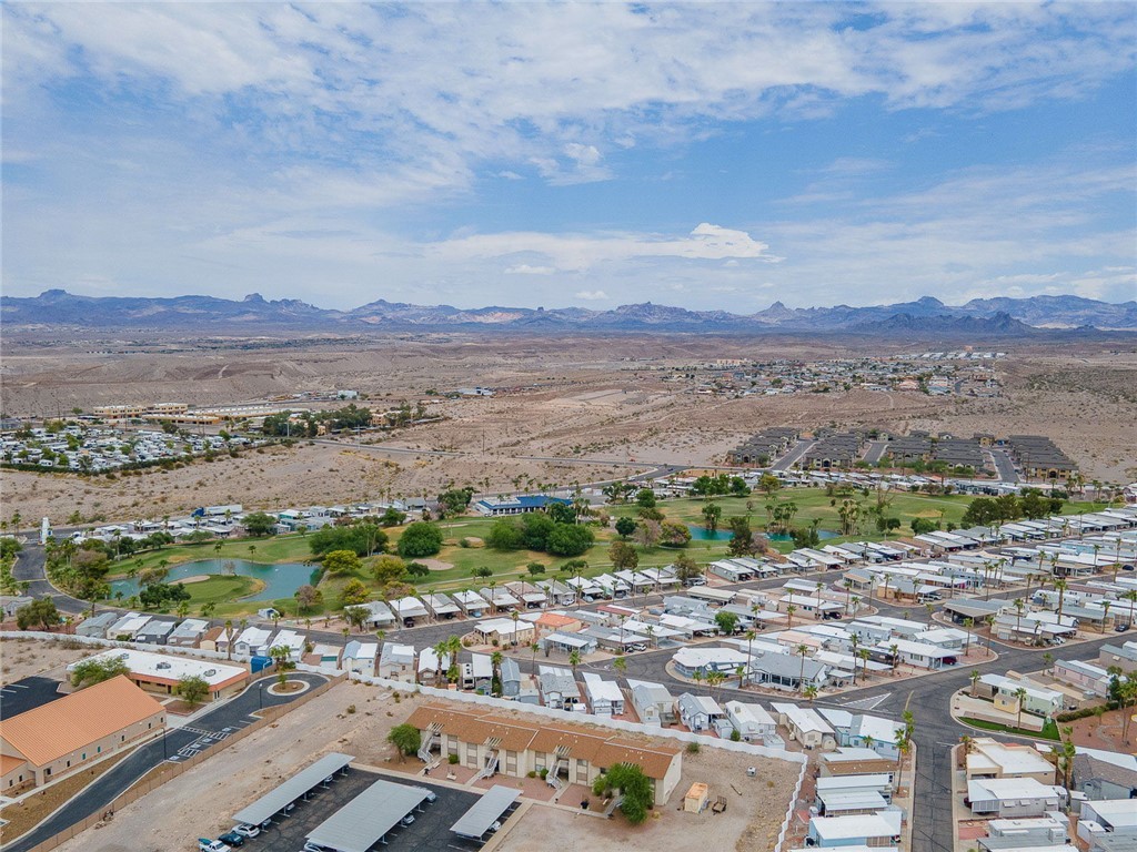 2000 Ramar Road, Unit 612 Bullhead City, AZ 86442 - Photo 53 of 77 Aerial view of property's location featuring a water and mountain view and nearby suburban area