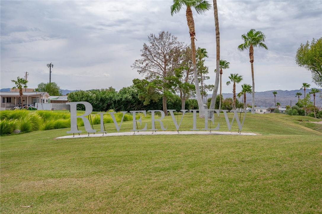 2000 Ramar Road, Unit 612 Bullhead City, AZ 86442 - Photo 54 of 77 View of community featuring a mountain view and a yard