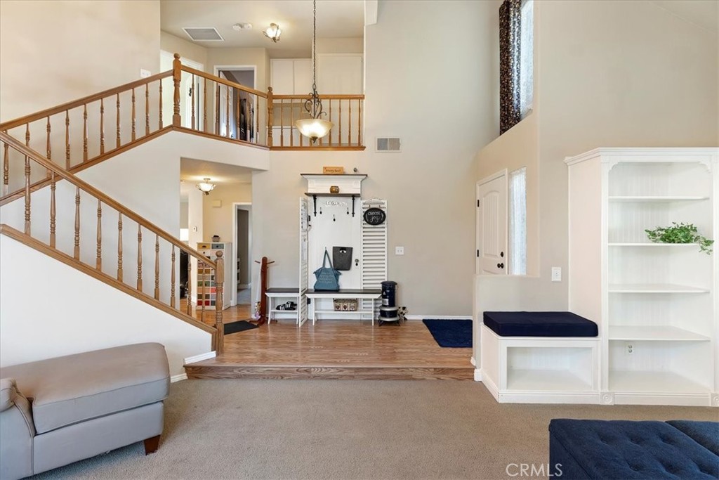 20637 Mesa Oak Drive Riverside, CA 92508 - Photo 20 of 66 a living room with furniture and a chandelier