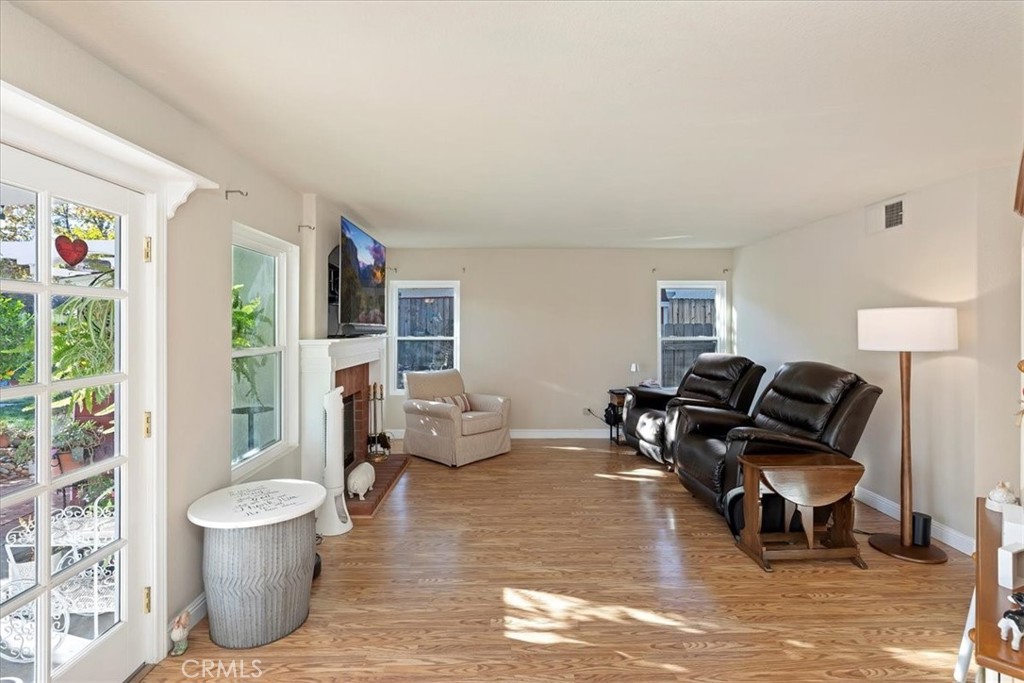 20637 Mesa Oak Drive Riverside, CA 92508 - Photo 26 of 66 a living room with furniture and a wooden floor