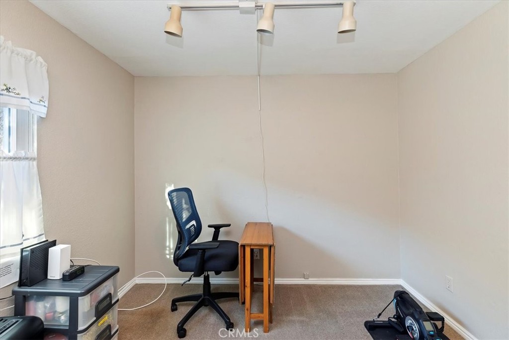 20637 Mesa Oak Drive Riverside, CA 92508 - Photo 34 of 66 a view of a workspace with furniture and a window