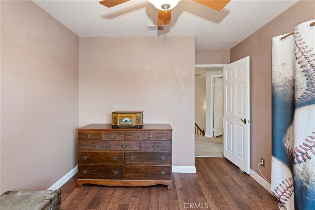 20637 Mesa Oak Drive Riverside, CA 92508 - Photo 36 of 66 a view of a hallway with wooden floor and staircase