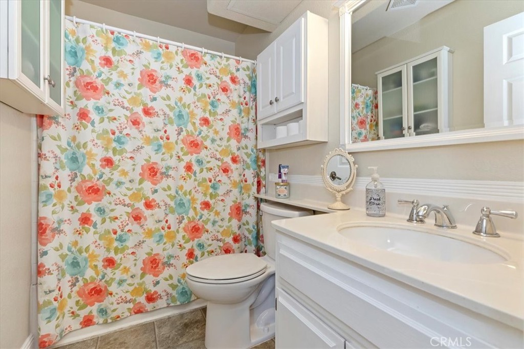 20637 Mesa Oak Drive Riverside, CA 92508 - Photo 39 of 66 a bathroom with a sink toilet and shower