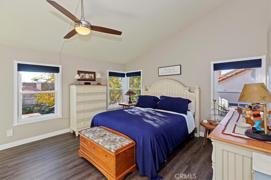 20637 Mesa Oak Drive Riverside, CA 92508 - Photo 40 of 66 a bedroom with a bed a dresser and wooden floor