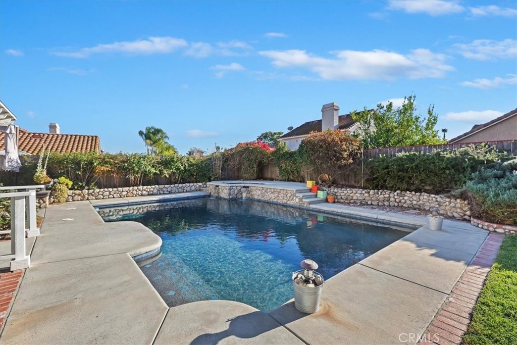 20637 Mesa Oak Drive Riverside, CA 92508 - Photo 51 of 66 a view of a swimming pool with lounge chair