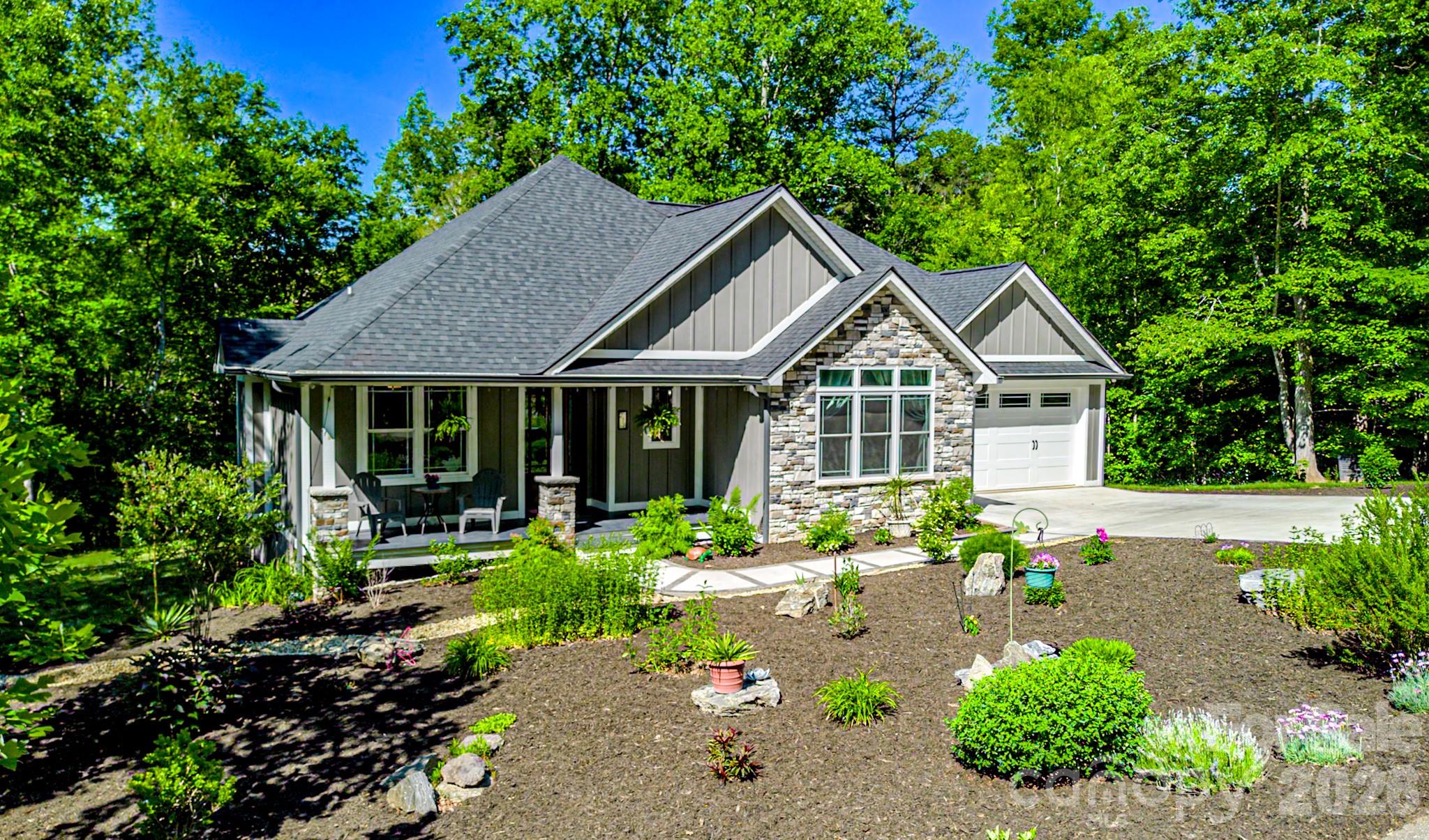 a front view of a house with garden