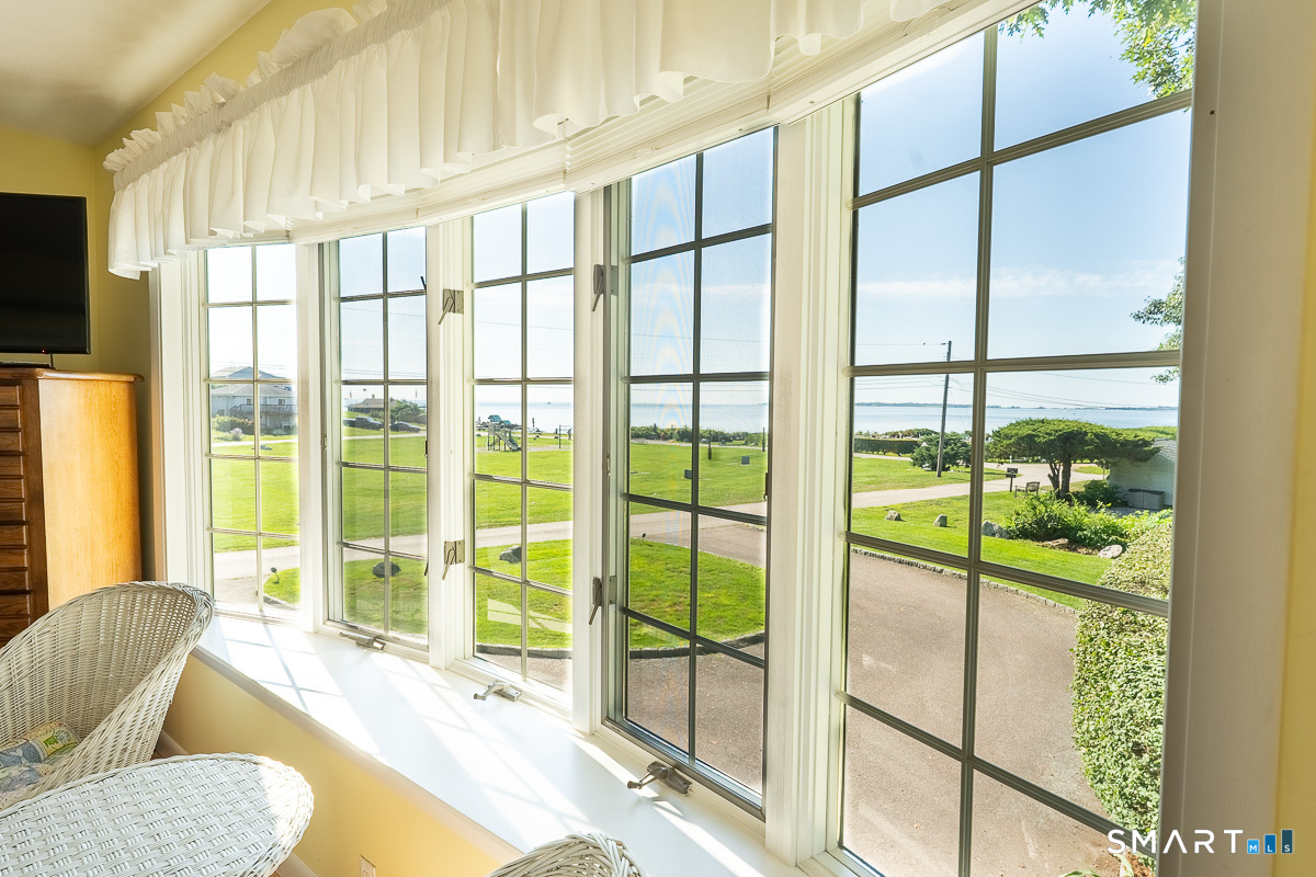 132 Latimer Point Road, Unit 132 Stonington, CT 06378 - Photo 19 of 38 Primary bedroom with captivating views of Fisher's Island Sound.