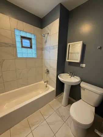a bathroom with a sink toilet and bathtub