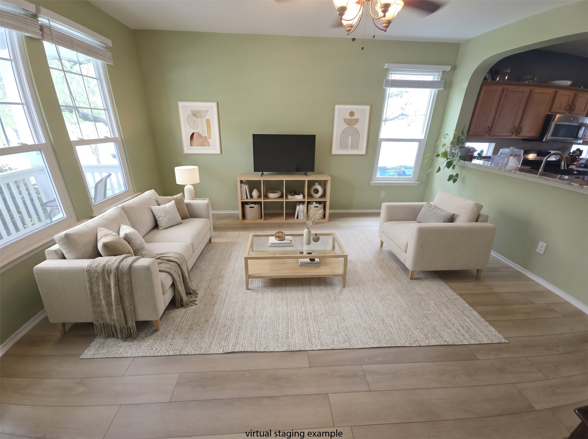 815 Bogart Road Cedar Park, TX 78613 - Photo 14 of 14 A well-lit living area offers an open floor plan, seamlessly connecting to the adjacent kitchen, creating an inviting space.
