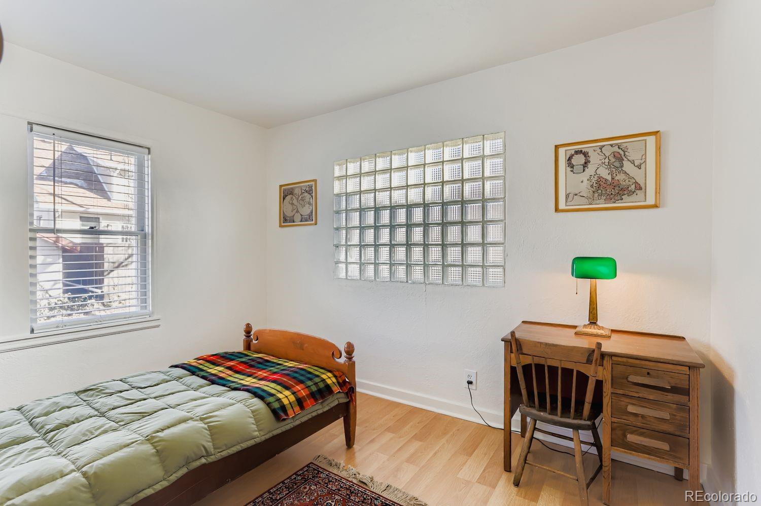 1010 9th Street Boulder, CO 80302 - Photo 14 of 28 a bedroom with a bed and a window