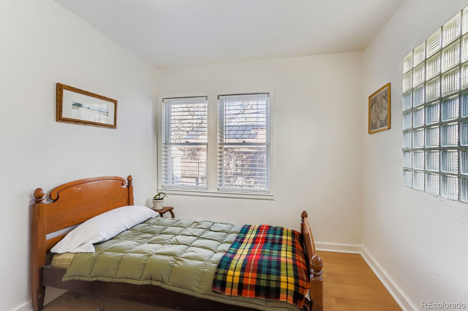 1010 9th Street Boulder, CO 80302 - Photo 15 of 28 a bedroom with a bed and a window