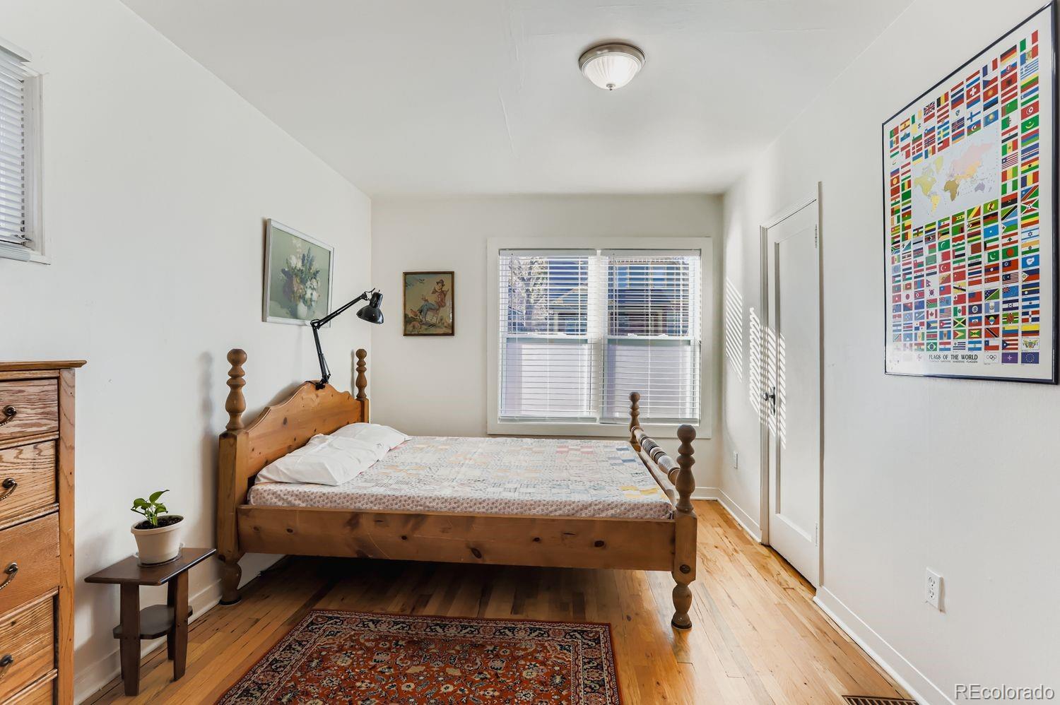 1010 9th Street Boulder, CO 80302 - Photo 17 of 28 a bedroom with bed and wooden floor