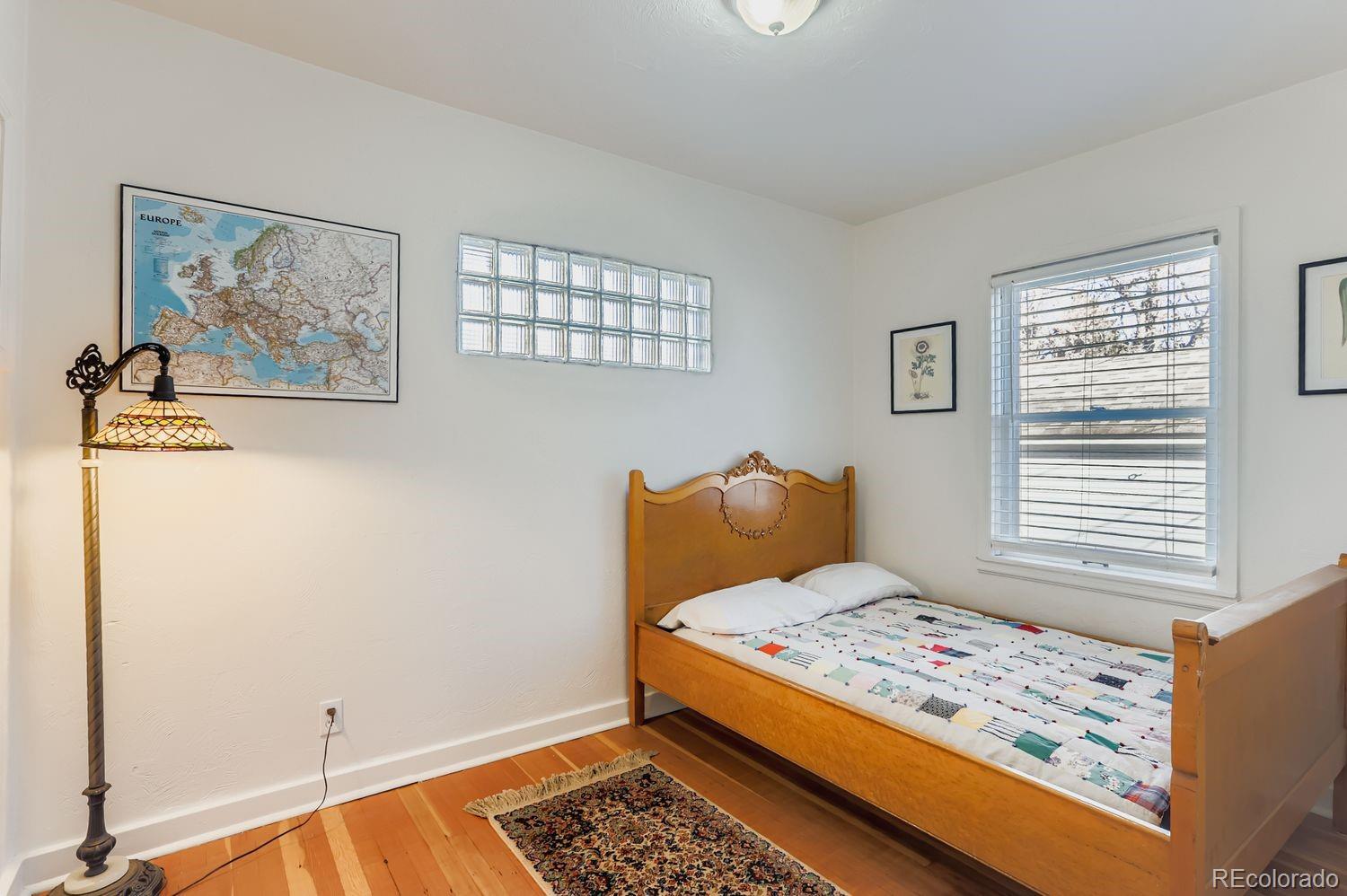 1010 9th Street Boulder, CO 80302 - Photo 20 of 28 a bedroom with a bed and a window