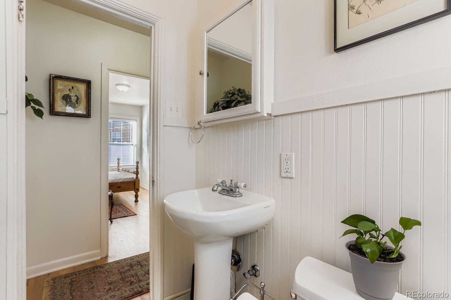1010 9th Street Boulder, CO 80302 - Photo 22 of 28 a bathroom with a sink and a mirror