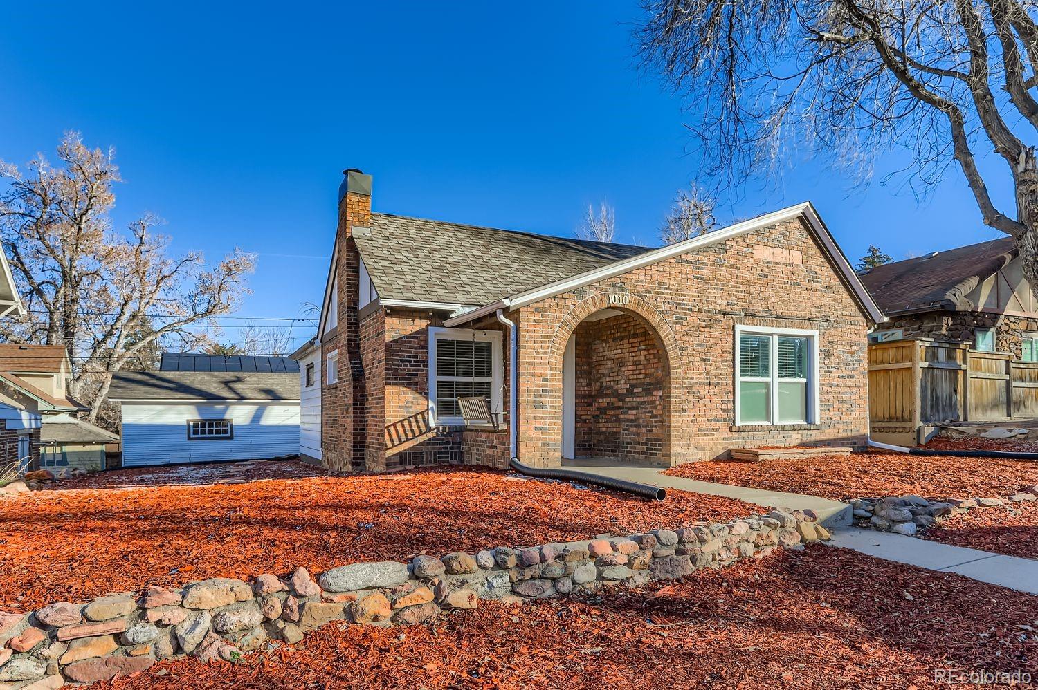 1010 9th Street Boulder, CO 80302 - Photo 3 of 28 a view of a house with a yard