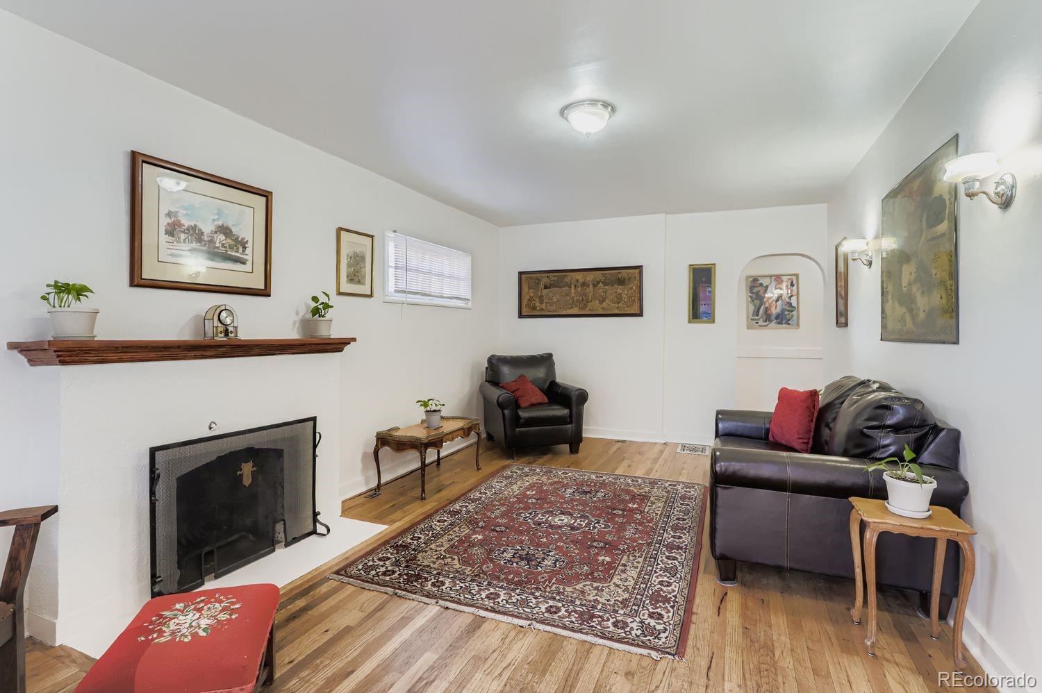 1010 9th Street Boulder, CO 80302 - Photo 8 of 28 a living room with furniture and a fireplace