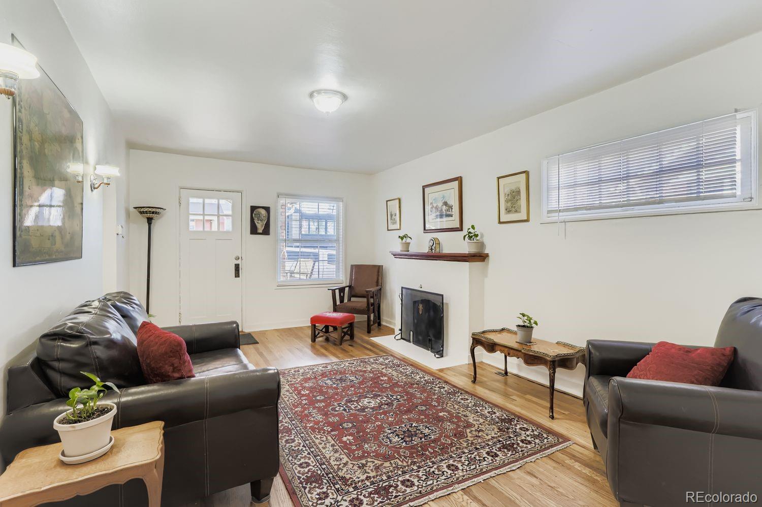1010 9th Street Boulder, CO 80302 - Photo 9 of 28 a living room with furniture and a fireplace