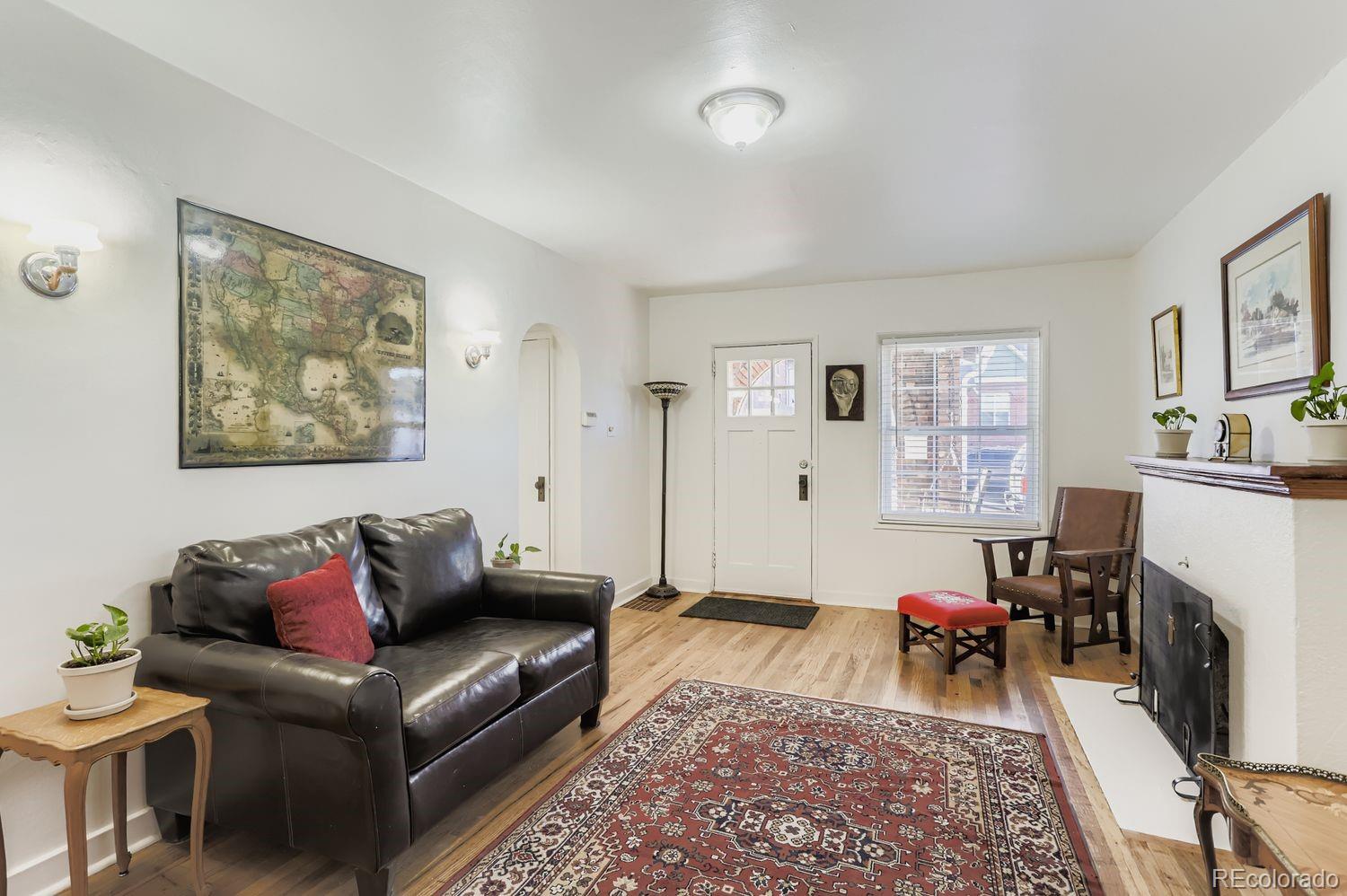 1010 9th Street Boulder, CO 80302 - Photo 10 of 28 a living room with furniture and a fireplace
